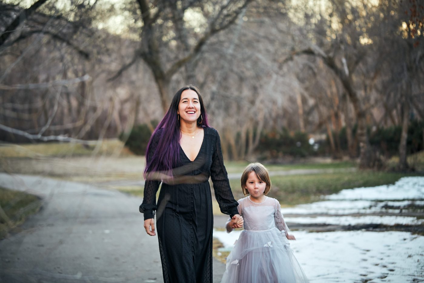 Christina Beebe, LMFT, walking outdoors with her daughter